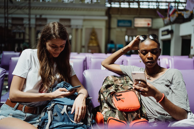 travelers using smartphones